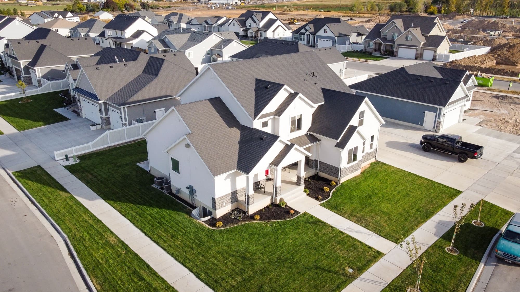 An aerial view of an ordinary suburban subdivision of single-family homes